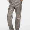 Coated pinstripe trousers