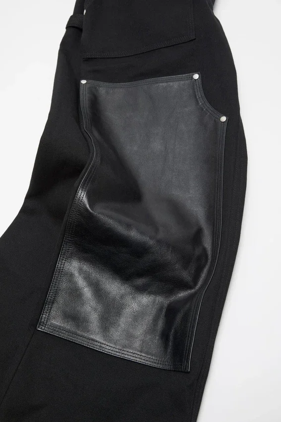 Denim trousers with leather patches