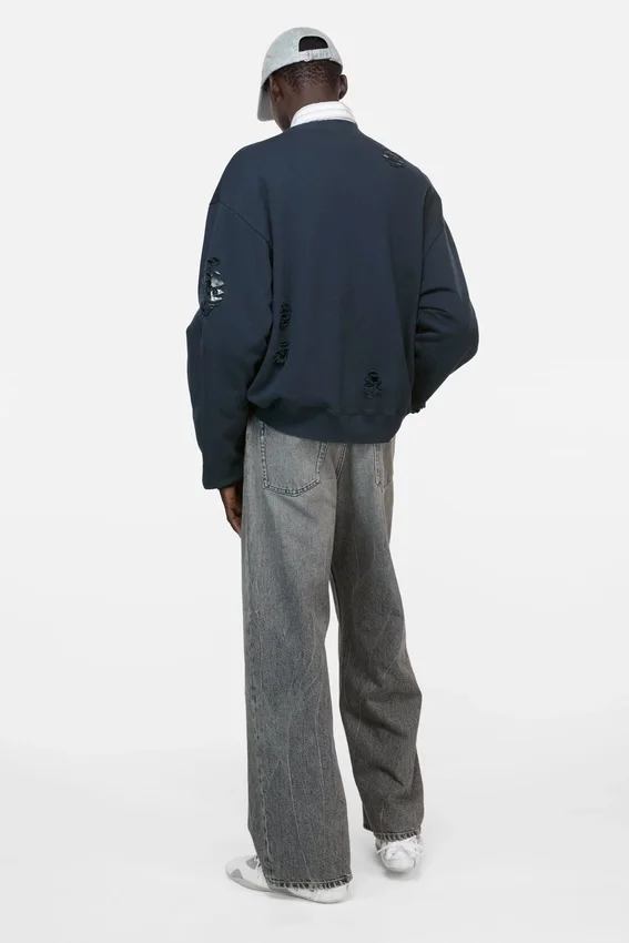 Distressed fleece sweatshirt