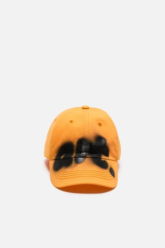 Sprayed graphic cap