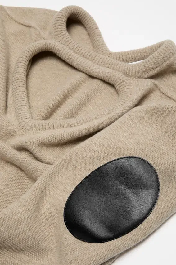 Wool sweater with cut-out